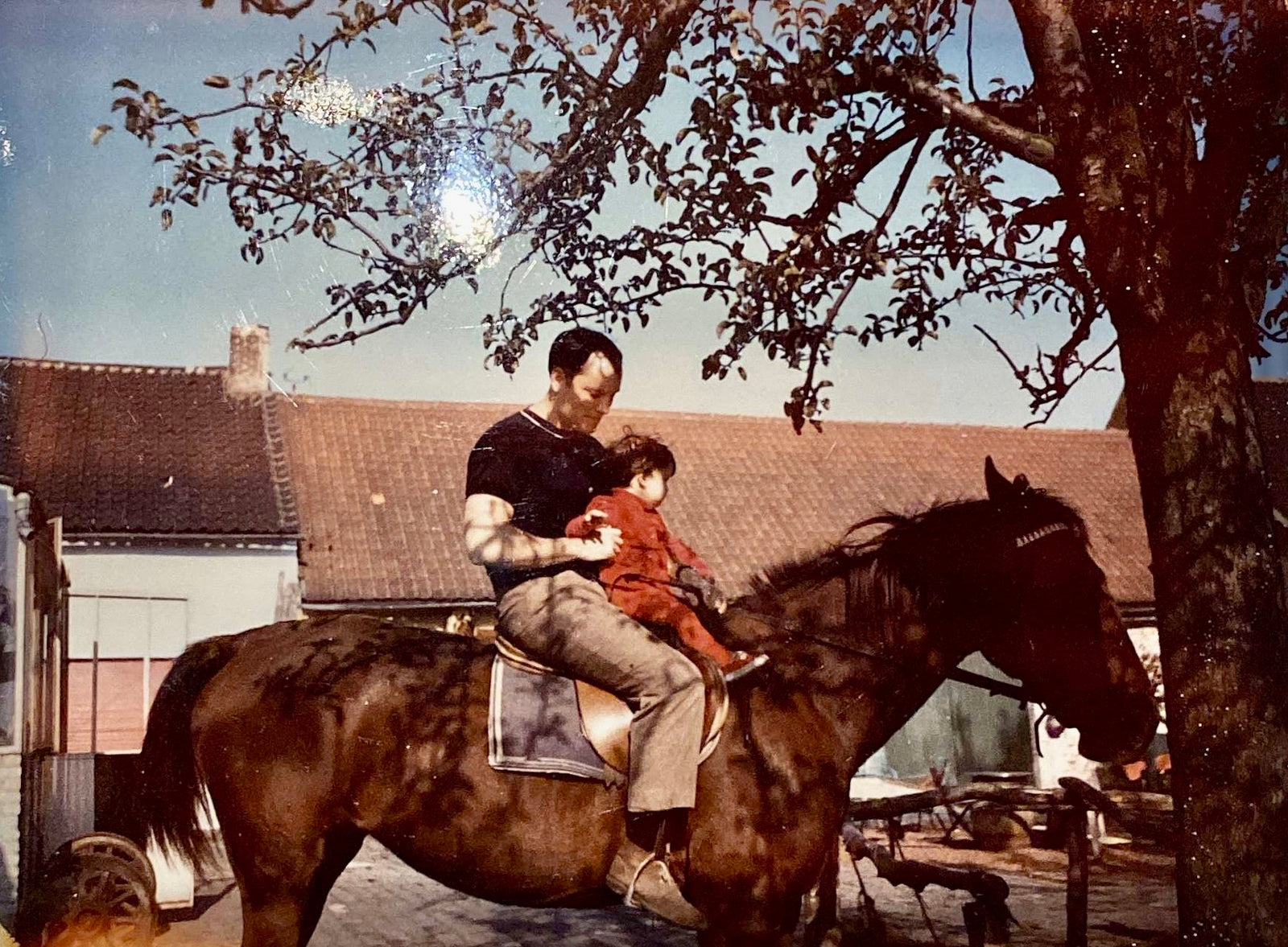 Graydon and her dad on a horse when she was a child